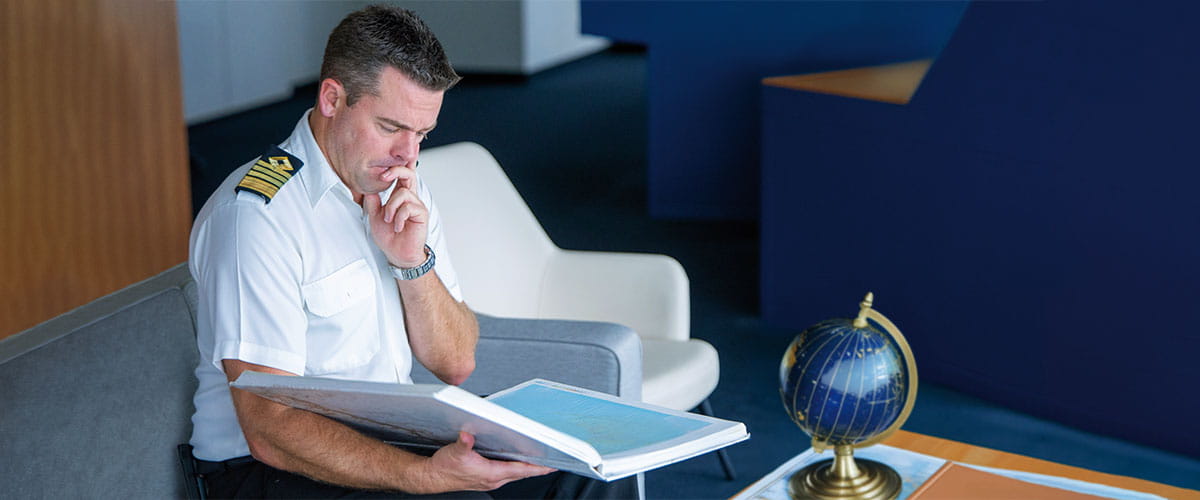 Captain Tanner choosing ports for his mystery cruise